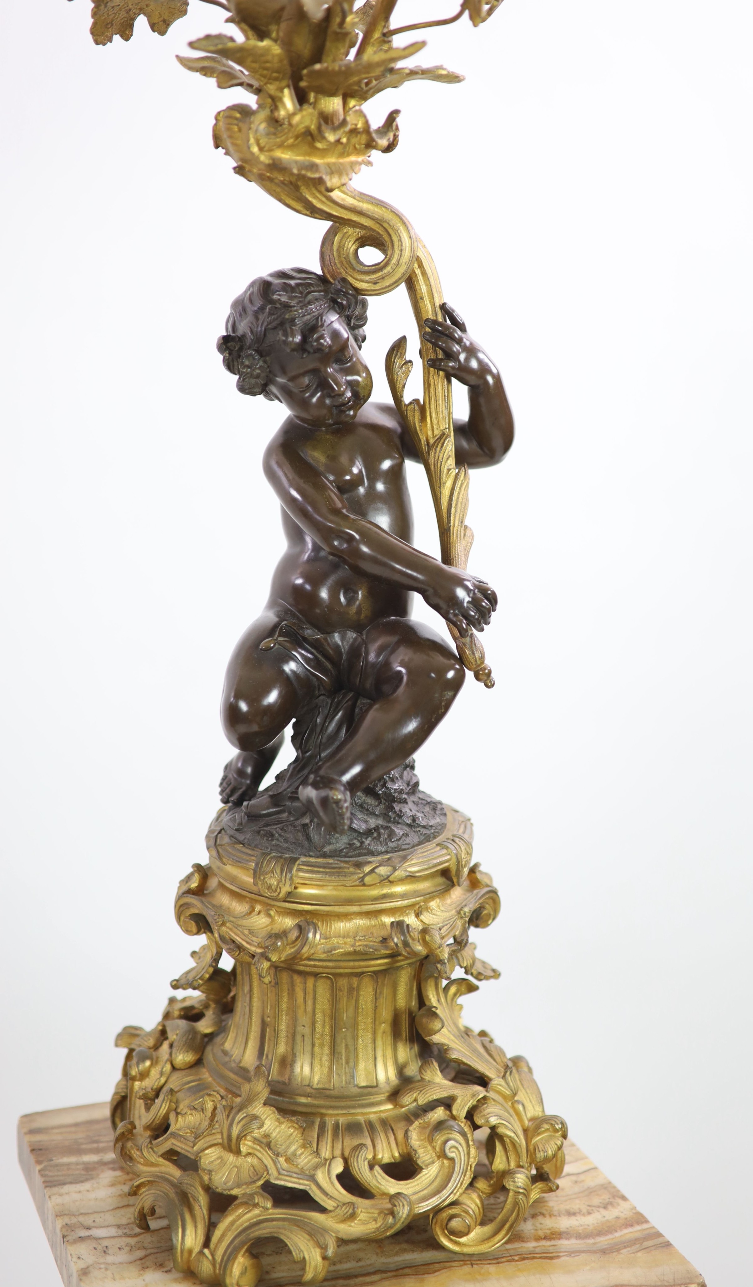 A pair of 19th century French bronze and ormolu six light candelabra, W.27cm H.109cm